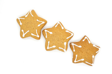 three gingerbread cookies in the shape of a star on a white background