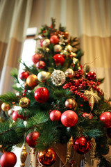 Christmas tree, gifts, candles, toys and other New Year decorations in the interior.