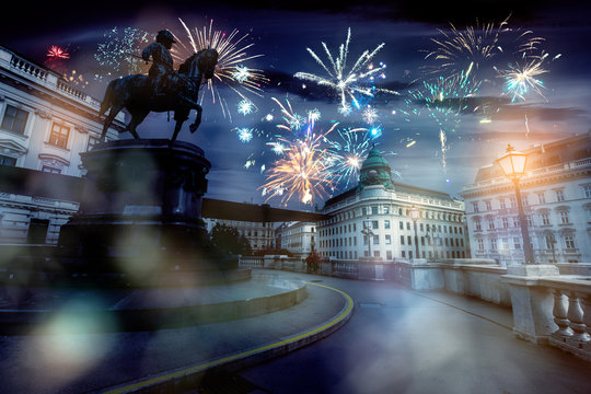 celebrate abstract holidays in vienna, austria, europe. christmas or new year fireworks at night. composite imagery