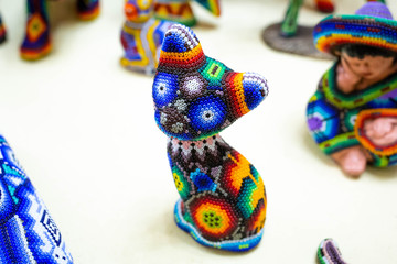 Traditional huichol bead ornament figures mexican culture
