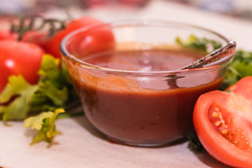 tomatoes paste with tomatoes on wooden tables