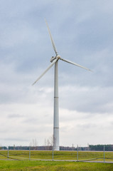 Renewable alternative clean wind energy produced by wind generators helps to preserve The earth's ecology. - 311619299