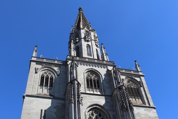 Fototapeta premium Historical Constance Cathedral (Konstanzer Muenster) isolated on blue sky in the city of Constance (Konstanz) in Baden-Wuerttemberg, Germany.