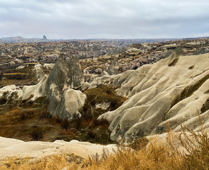 Ancient rock formations with caves. A famous place for flying in balloons. Cappadocia. Turkey November 5, 2019.