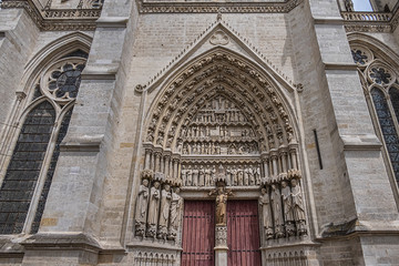 Fototapeta premium Architectural fragments of the central portal Amiens Gothic Cathedral (Basilique Cathedrale Notre-Dame d'Amiens, 1220 - 1288). Amiens, Somme, Picardie, France.