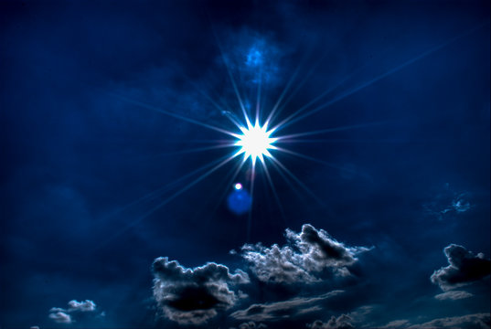 sun silhouette on a dark blue sky, good to be isolated 