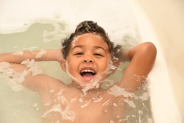 Toddler having fun at bathtime