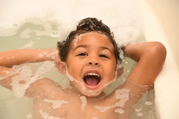 Toddler having fun at bathtime