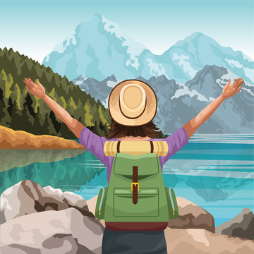 Beautiful lake and mountains landscape with traveler woman with hat and backpack