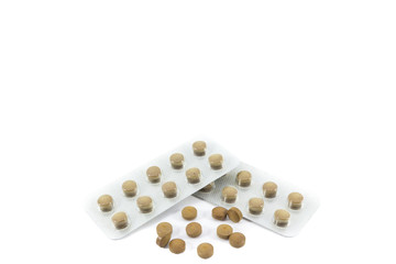 Closeup of brown pills isolated on white background. Health care concept.