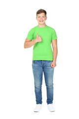 Fototapeta premium Young man showing thumb up isolated on white background