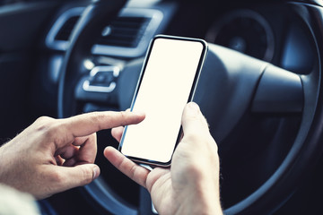 Man using mobile phone in the car