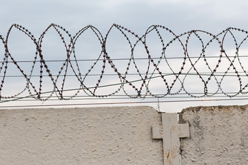 Barbed wire over the fence