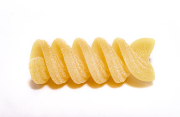 Italian raw Pasta Fusilli one strand of spaghetti. Close up. white background.
