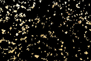 Glitter gold confetti isolated on black background. Festive party or holiday sparkle backdrop. Foil...