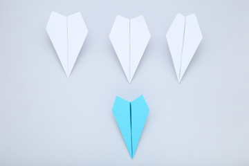 Paper plane leader on grey background