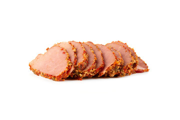 Slices of smoked beef in spices close-up. Smoked tenderloin cut into slices close-up.