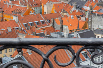 Top view to red terracotta roof tiles, old town architecture.