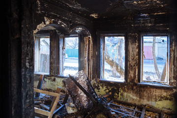 Burnt old rural house interior. Consequences of fire