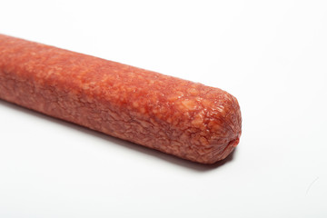 appetizing salami whole sausage stick isolated on white background