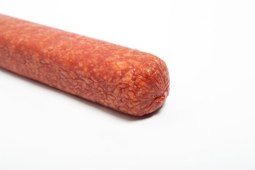 appetizing salami whole sausage stick isolated on white background