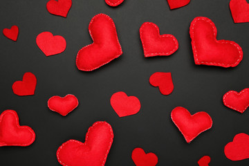 Fabric hearts on black background