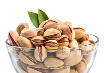 Fototapeta premium Pistachios in Glass Bowl on white background