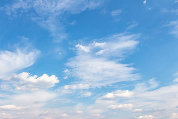 Naklejka na ściany i meble White clouds in the blue sky. Background. Texture