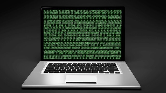Laptop computer with green Matrix binary code