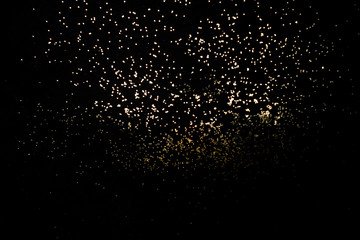 Golden shiny background of sparkles.