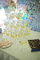 Table for guests with pyramids of champagne glasses 2247.