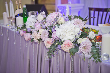The composition of flowers as the Central decoration of the festive table