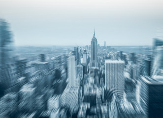 Flying over the skyscrapers of a big city. Manhattan, aerial view. Motion blur.
