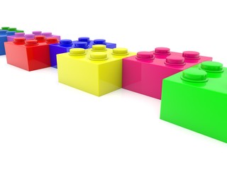 Toy bricks in a row one after another