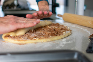 rolling cinnamon roll dough 