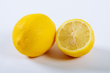 Lemon on a white background. The concept of a healthy diet, weight loss.
