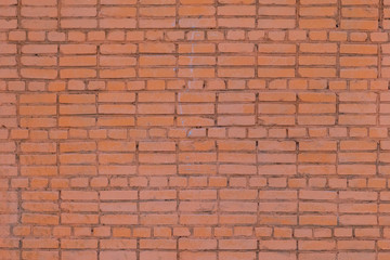 Fototapeta na wymiar Low contrast texture of red bricks wall as a background