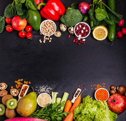 Frame of Organic food on a black background. Fresh vegetables, fruits,cereals and legumes.Vegan and...