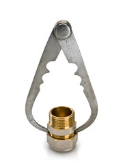 Measurement of a carving of a brass detail by an ancient calipers.