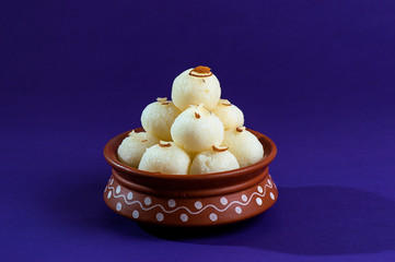 ndian Sweet or Dessert - Rasgulla in clay pot