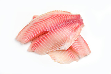 Raw tilapia fillet fish isolated on white background for cooking food - Fresh fish fillet sliced for steak or salad - 311650045