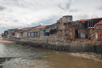 Old destroyed buildings at the shore, Salvador, Bahia, Brazil, South America