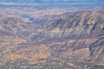 Wasatch Front Rocky Mountain Range Aerial view from airplane in fall including urban cities and the Great Salt Lake around Salt Lake City, Utah, United States of America. USA.