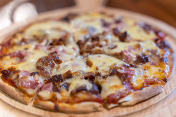 Hot homemade barbecue chicken pizza with onions and cheese.