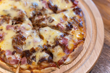 Hot homemade barbecue chicken pizza with onions and cheese.