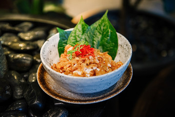Fried rice decorated with betel leaves
