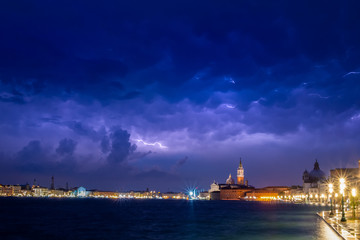 Obraz na płótnie Canvas Venice - view from Giudecca to San Giorgio Maggiore at night during thunderstorm.