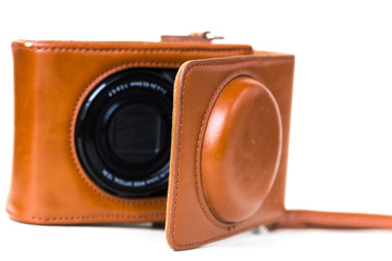 A camera is isolated on a white background.