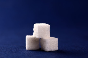 Close-up of Sugar Cubes on Blue Background