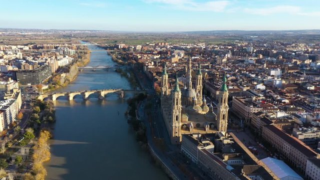 Aerial large sunset view over Saragossa Bas&iacute;lica del Pilar river Ebro Puente de Piedra Spain